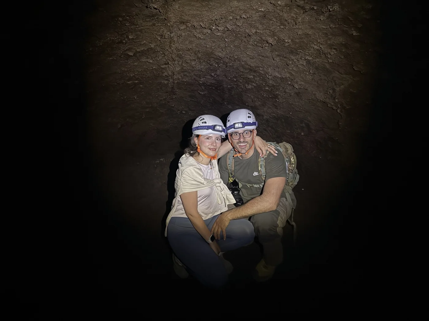 Roberto Saitta with guests during a guided Mount Etna lava cave experience